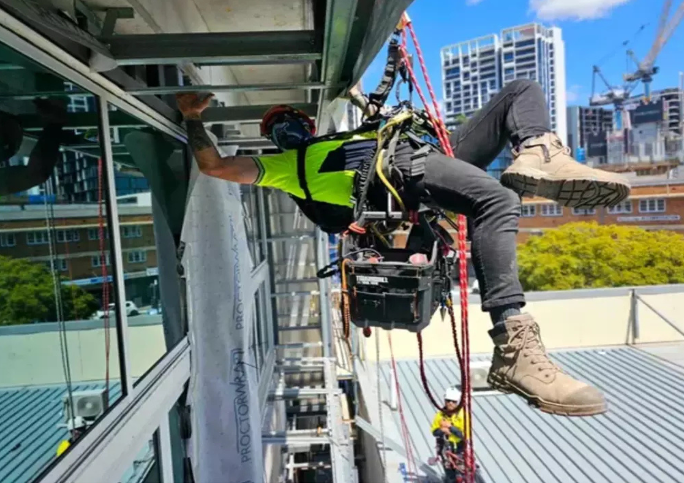 Rope access cladding work on building