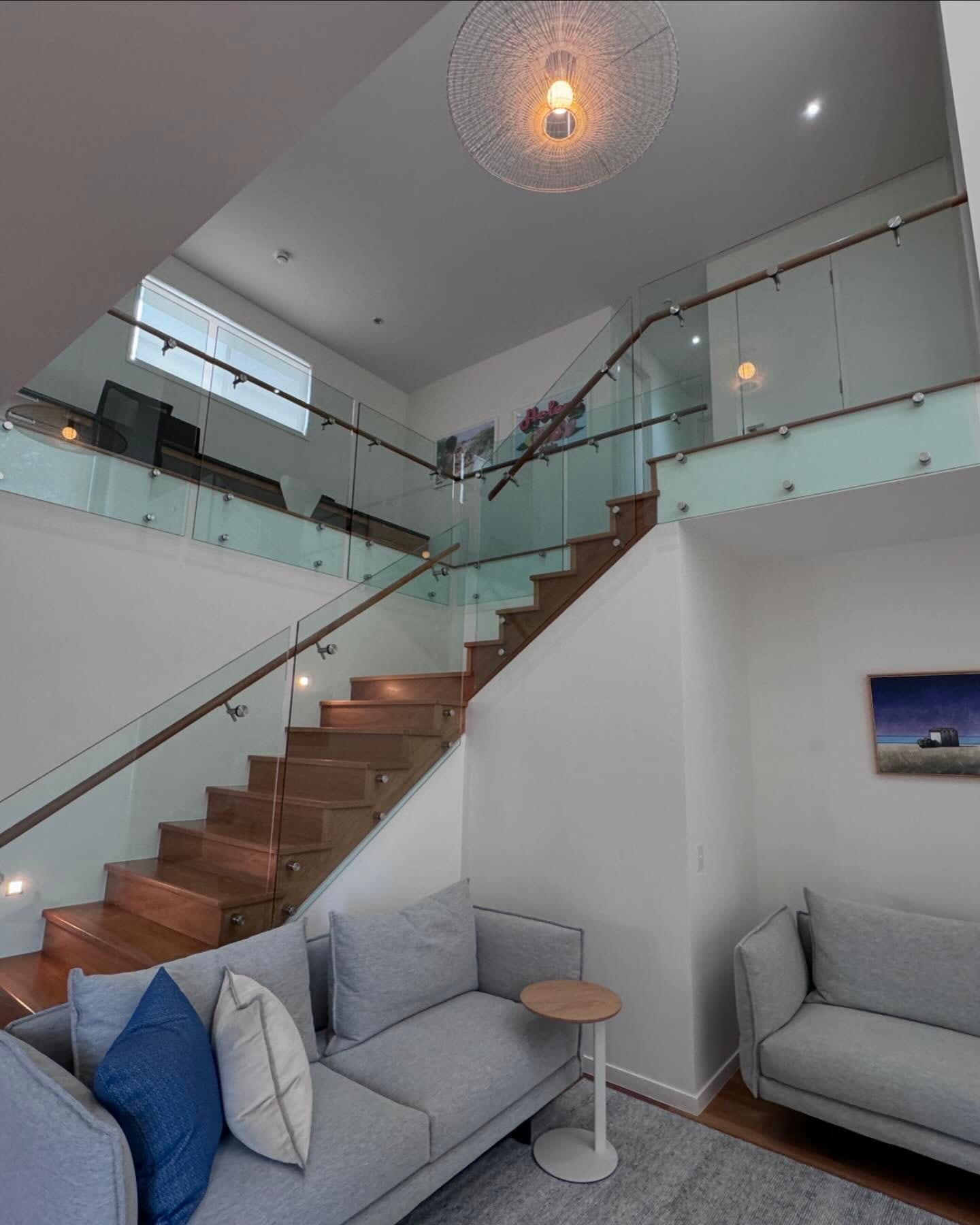 Modern staircase with glass railing interior