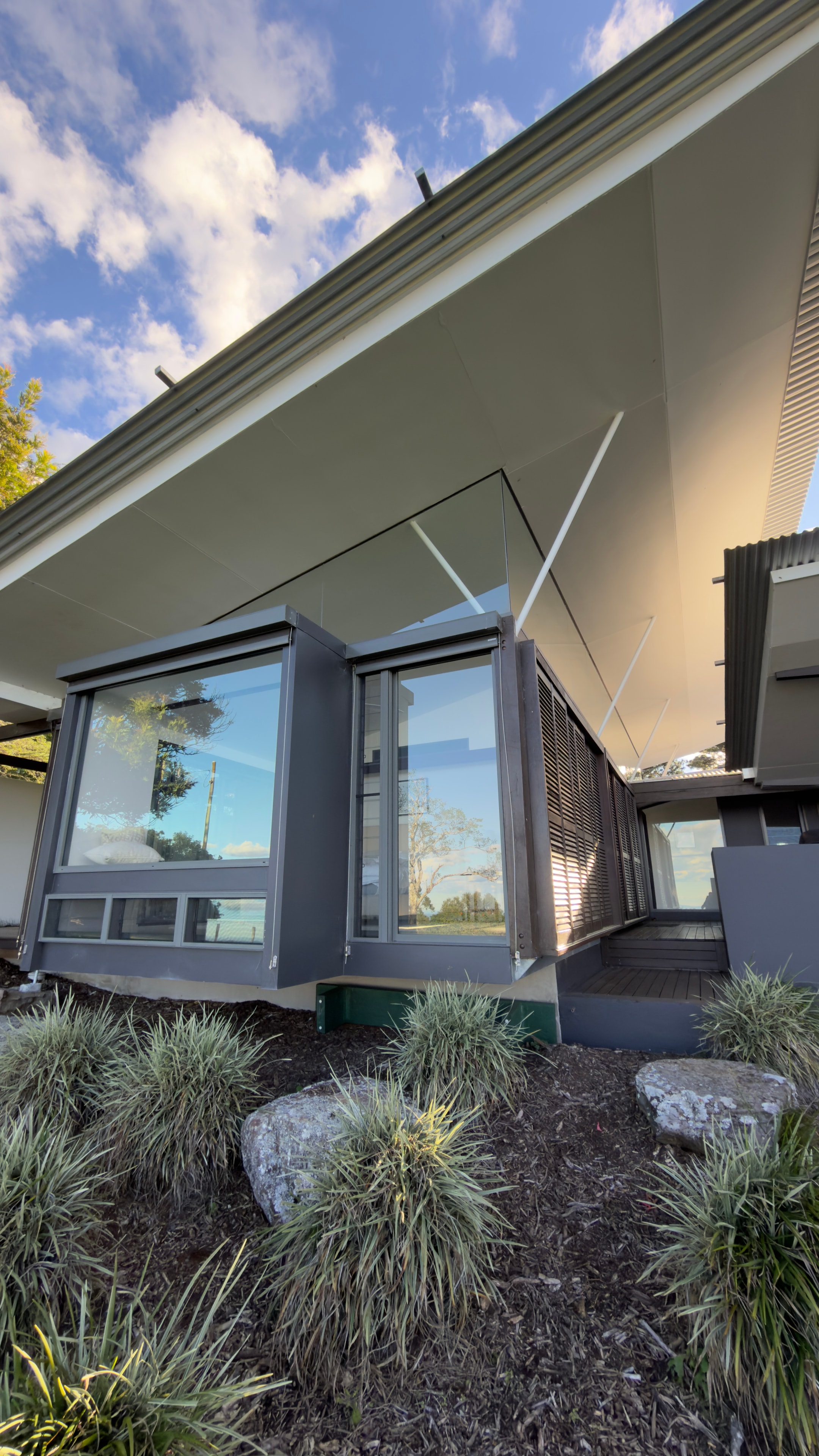 Modern house exterior with large windows