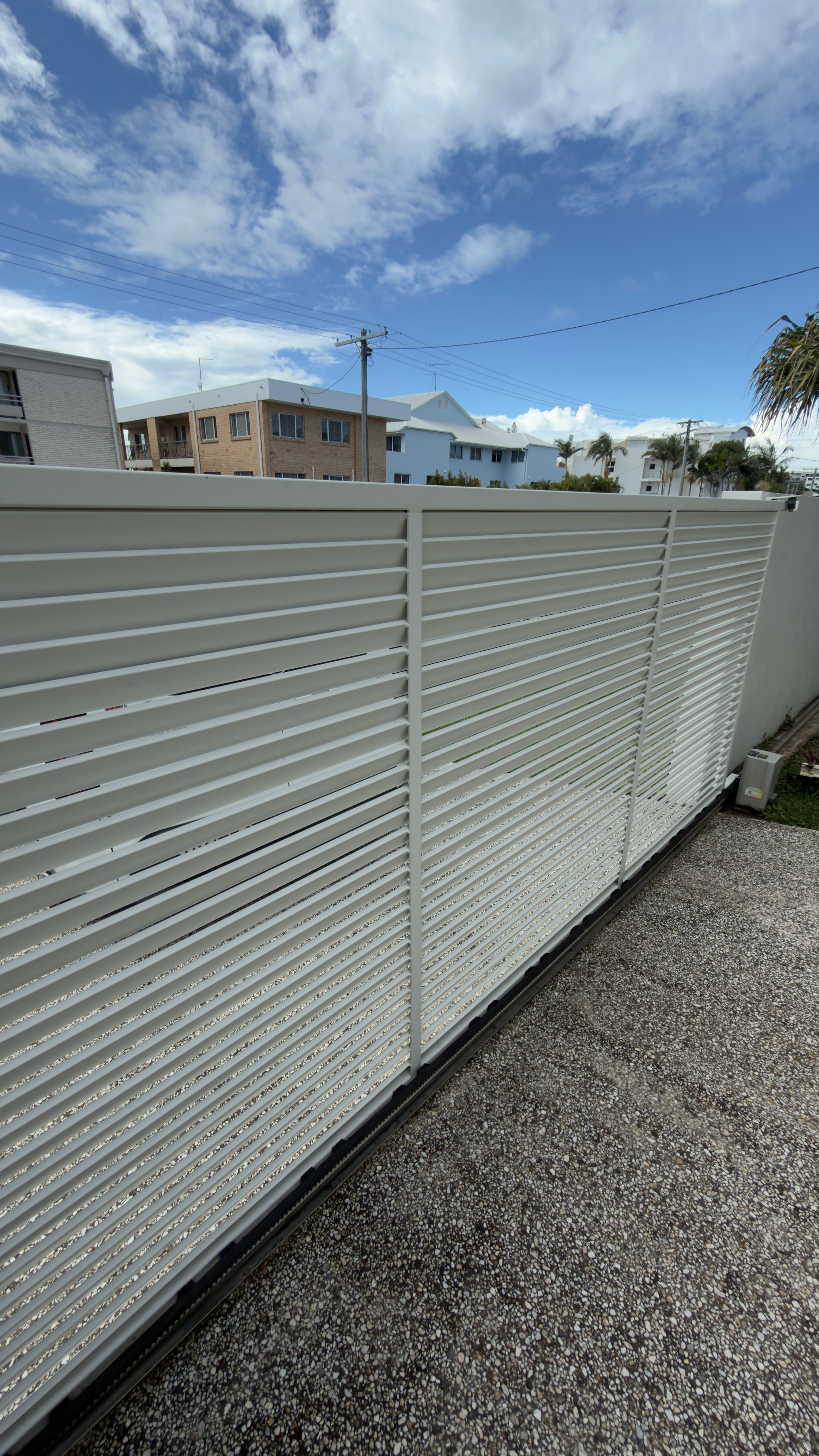 White metal fence residential neighbourhood