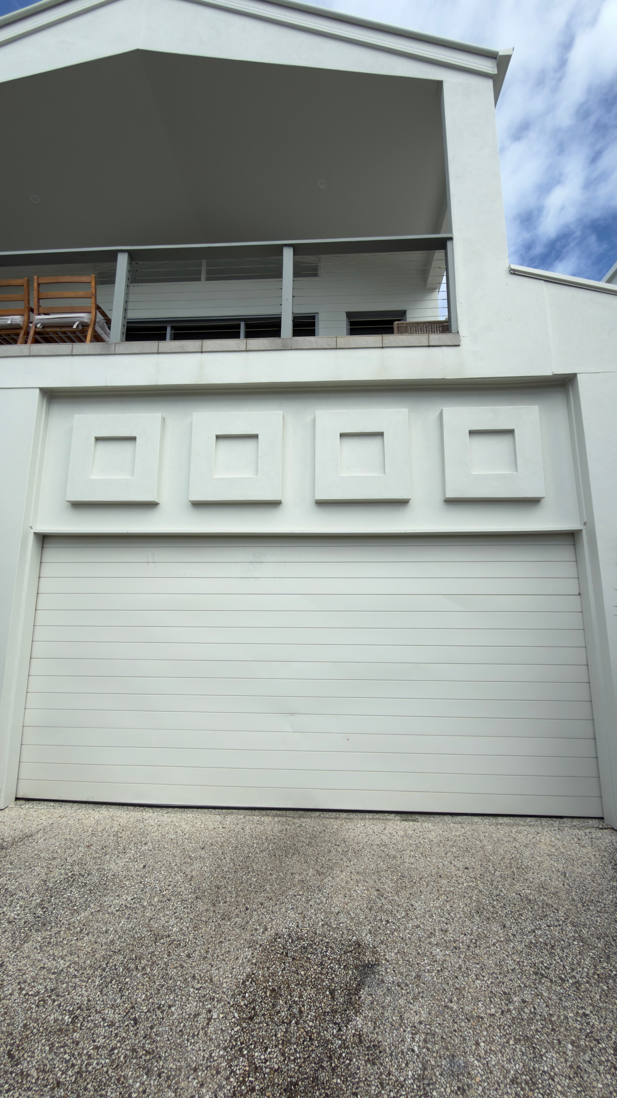 Modern white house garage door exterior