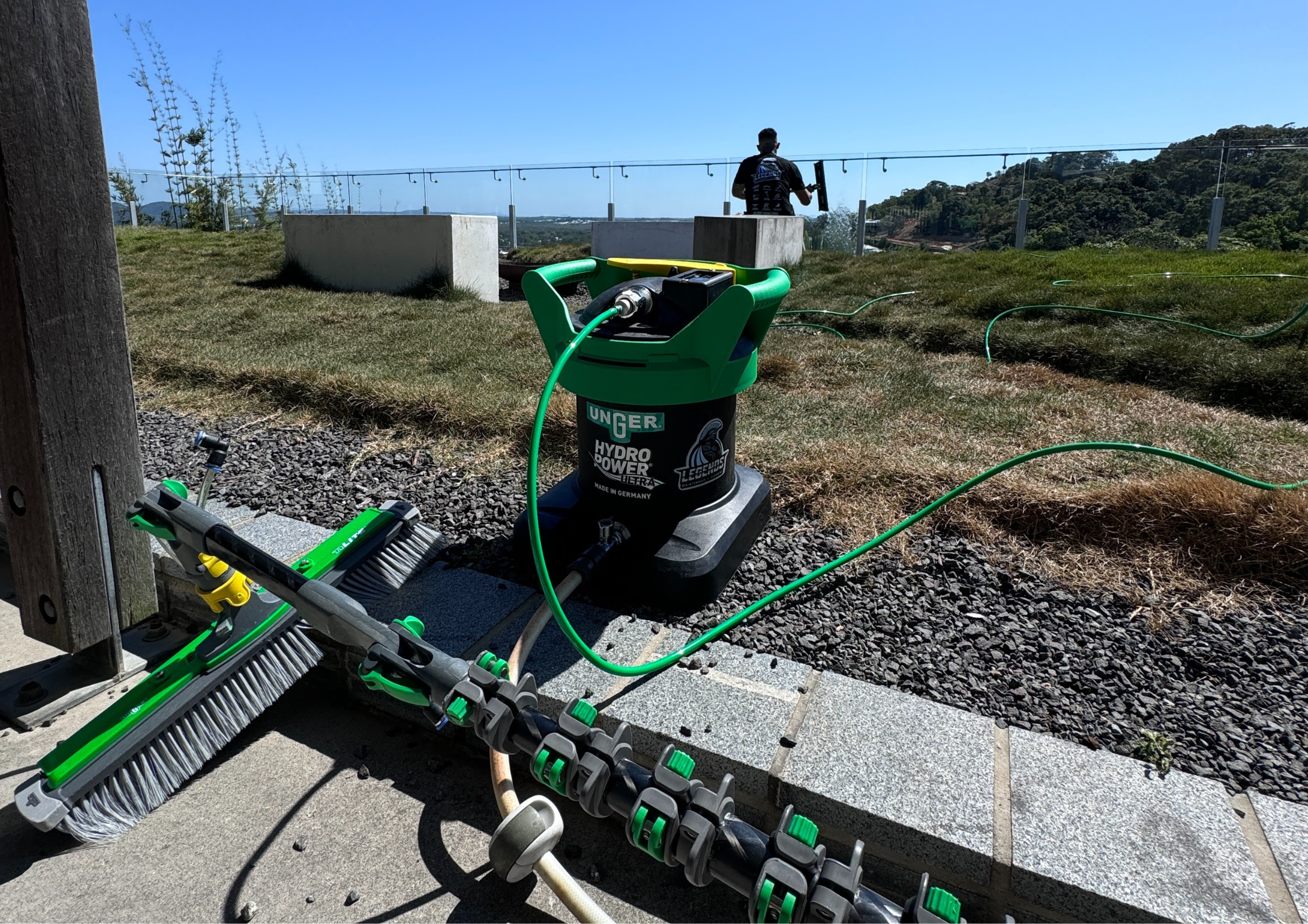 Professional window cleaning equipment in use