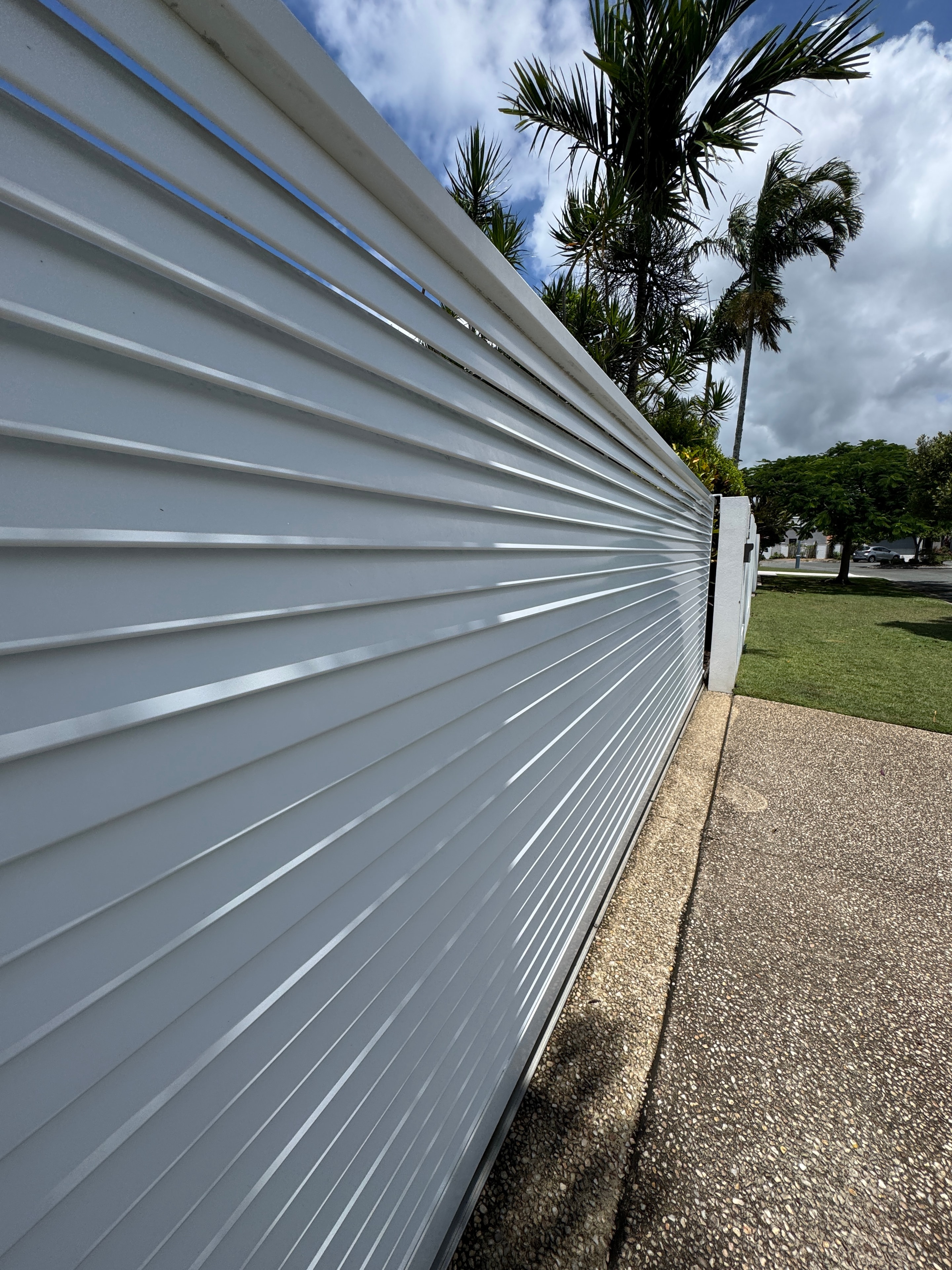 White corrugated metal fence tropical setting