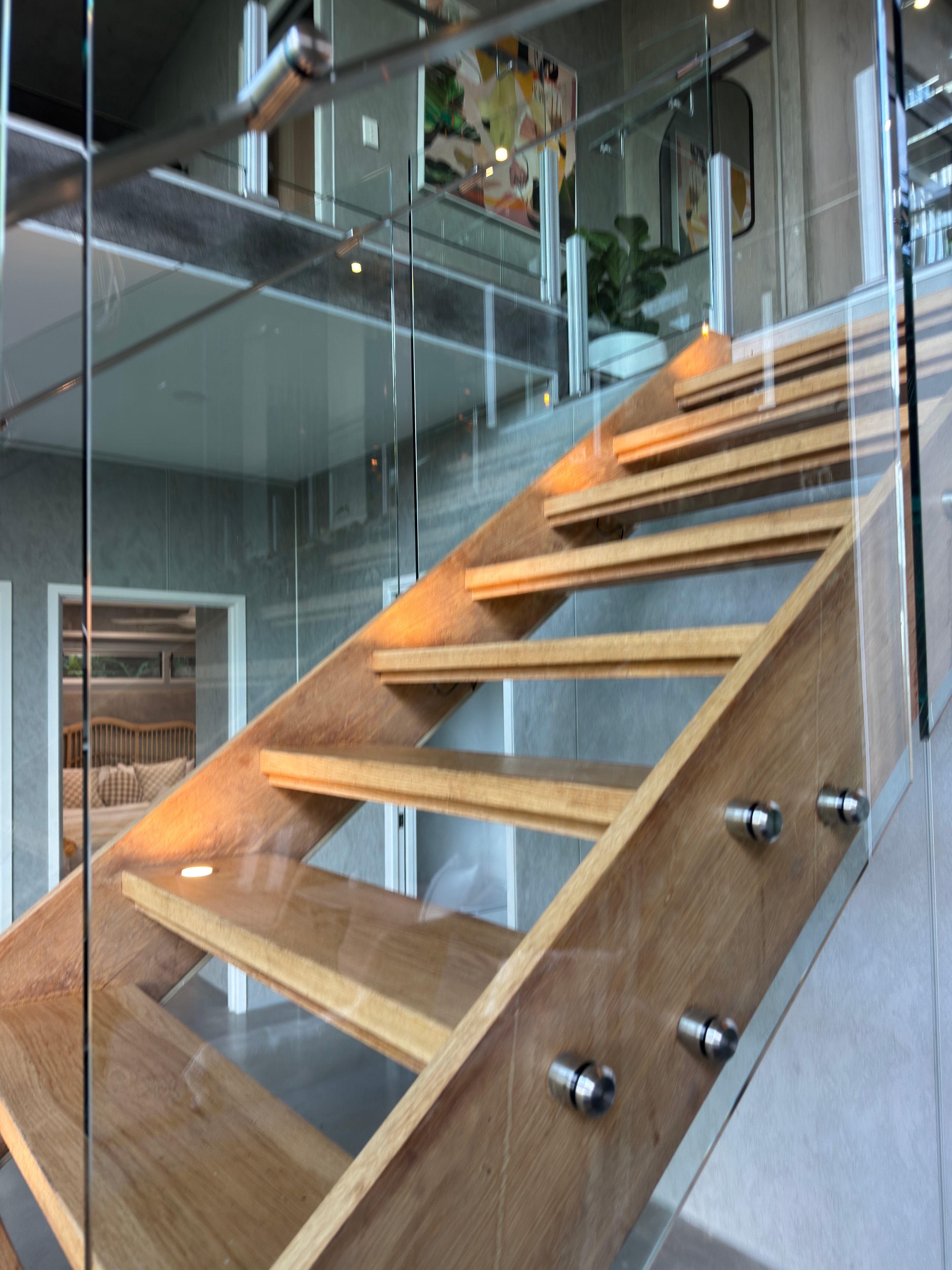Modern wooden staircase glass railing interior